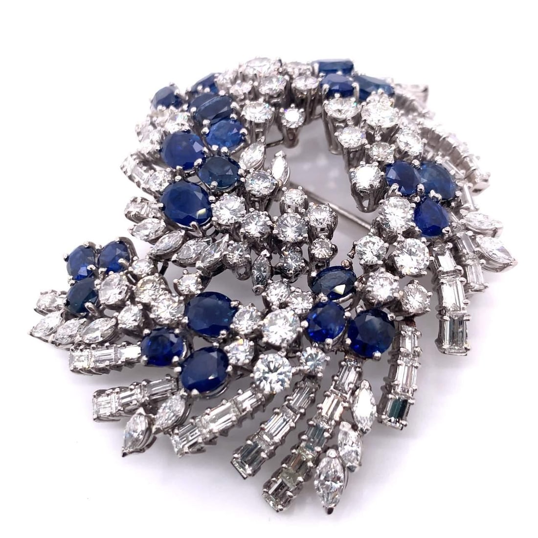 Art Deco Platinum Pin with 23 Sapphires and 18 Ct Diamonds: Art Deco Platinum Pin with 23 Sapphires and 18 Ct Diamonds This exquisite Art Deco pin showcases a stunning combination of diamonds and sapphires, perfect for adding a touch of elegance to any outfit.