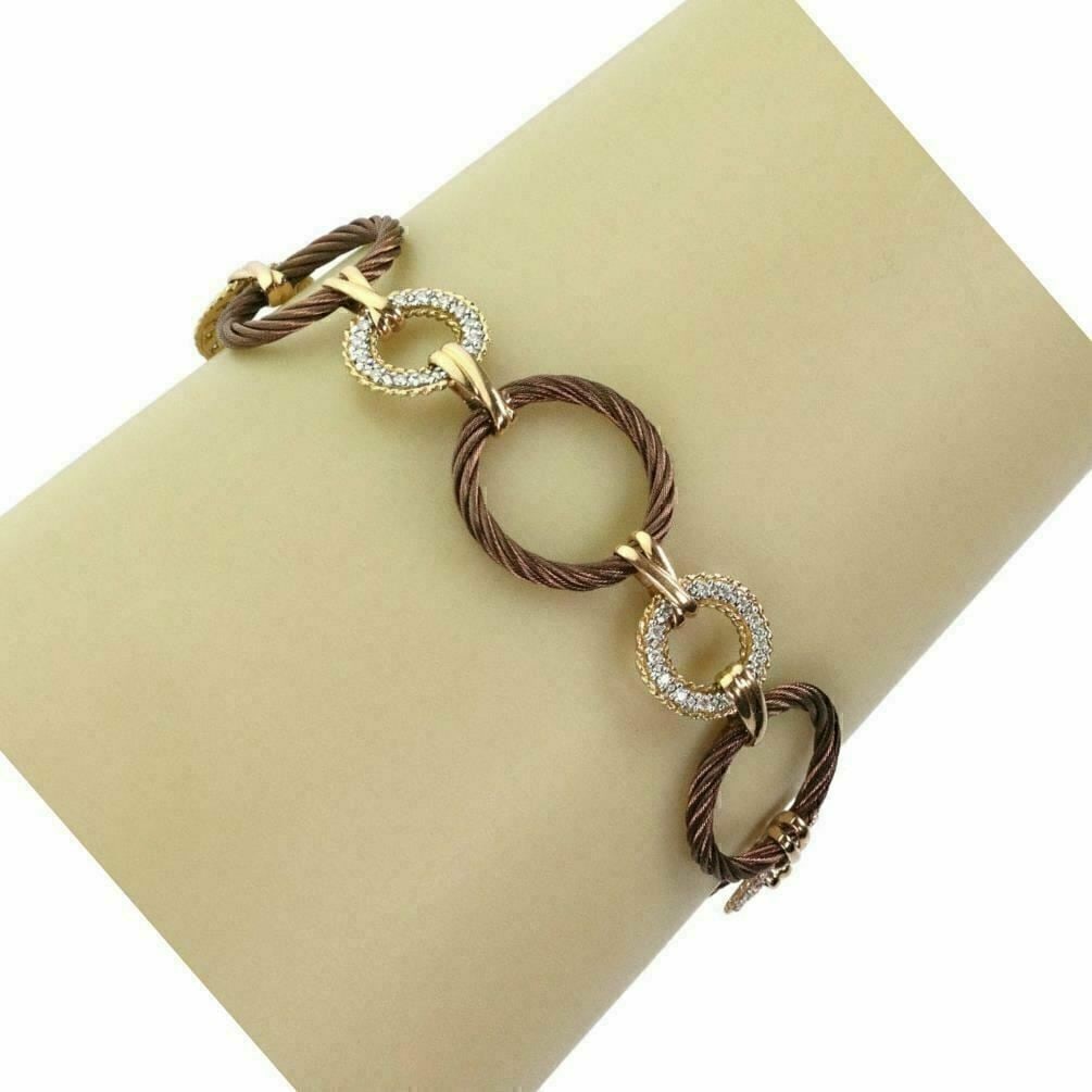 Charriol diamond toggle bracelet stainless steel 18k gold circle links: Charriol diamond toggle bracelet stainless steel 18k gold circle links This authentic Charriol bracelet features a bold circular link design crafted in stainless steel with 18k yellow gold accents. Th