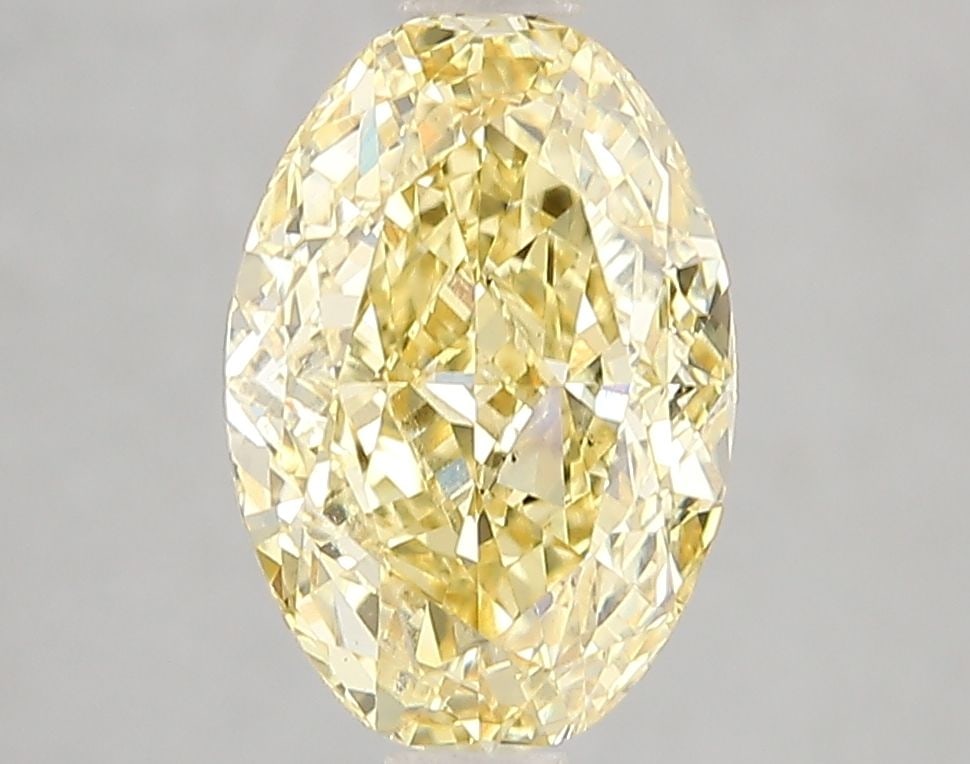 Loose Diamond - OVAL 3.03ct Fancy Vivid Yellow VS1: Loose Diamond - OVAL 3.03ct Fancy Vivid Yellow VS1 Source: This is a real non-mined Diamond that has been grown in a lab Shape: OVAL Carats: 3.03 Color: Fancy Vivid Yellow Certification: IGI Video: