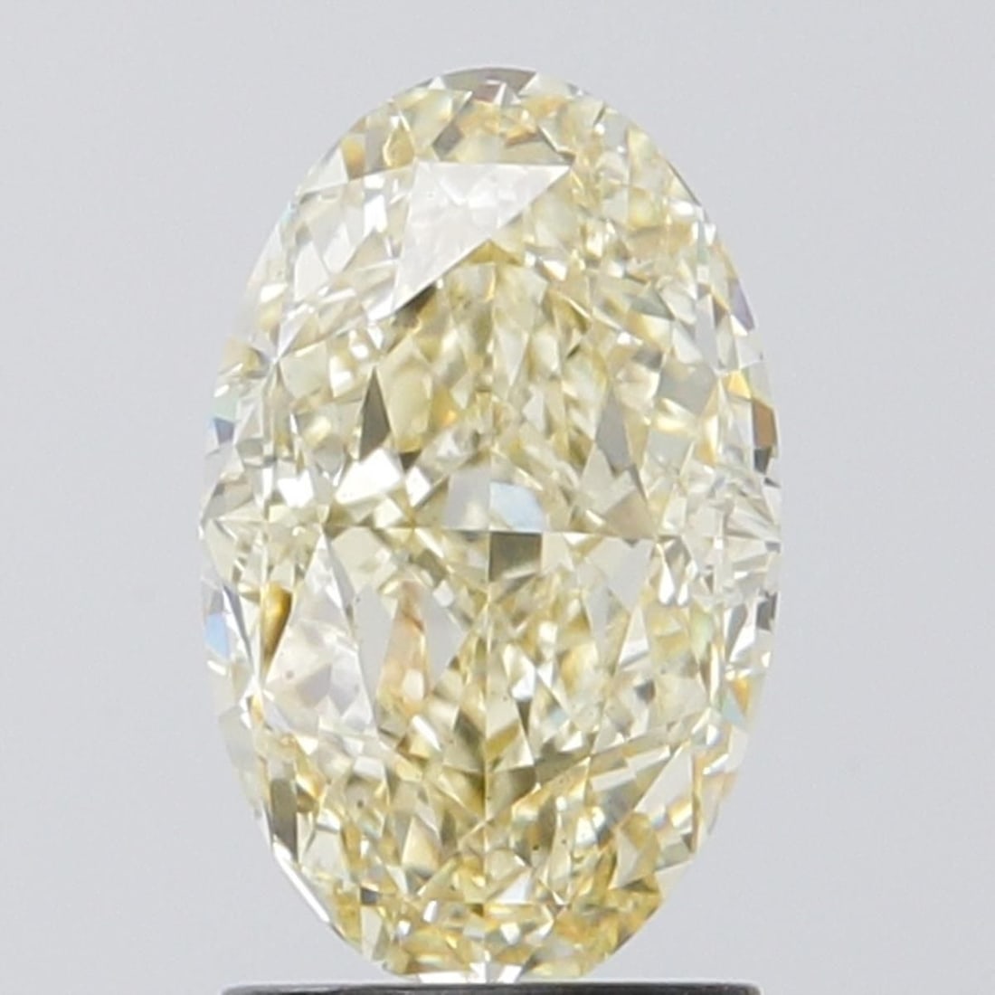 Loose Diamond - OVAL 2.1ct Fancy Intense Yellow VS2: Loose Diamond - OVAL 2.1ct Fancy Intense Yellow VS2 Source: This is a real non-mined Diamond that has been grown in a lab Shape: OVAL Carats: 2.1 Color: Fancy Intense Yellow Certification: IGI Video: