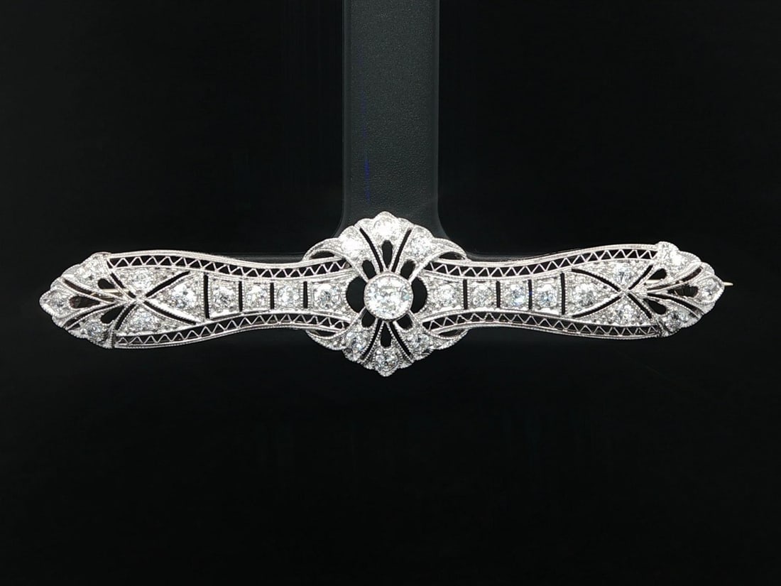 Edwardian Platinum and White Gold Diamond Filigree Floral Bar Pin Brooch: Edwardian Platinum and White Gold Diamond Filigree Floral Bar Pin Brooch This antique Edwardian bar brooch features an intricate filigree floral design crafted from solid .800+ platinum with a 12k whi