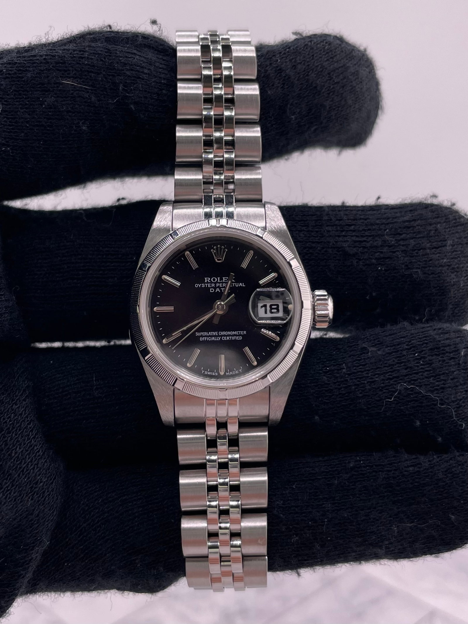 Ladies Rolex Oyster Perpetual Date 69190 Jubilee Black Dial Papers: Ladies Rolex Oyster Perpetual Date 69190 Jubilee Black Dial Papers This Rolex Oyster Perpetual Date features a black dial and is paired with a Jubilee bracelet. The watch is identified by reference nu