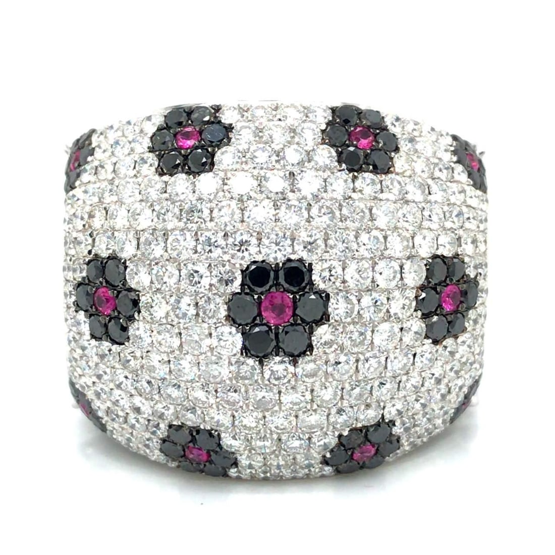 18K White Gold Ring with Diamonds and Pink Sapphires: 18K White Gold Ring with Diamonds and Pink Sapphires This stunning 18K white gold ring showcases a beautiful arrangement of 11 pink sapphires and sparkling diamonds. Weighing 25.8 grams, the ring feat
