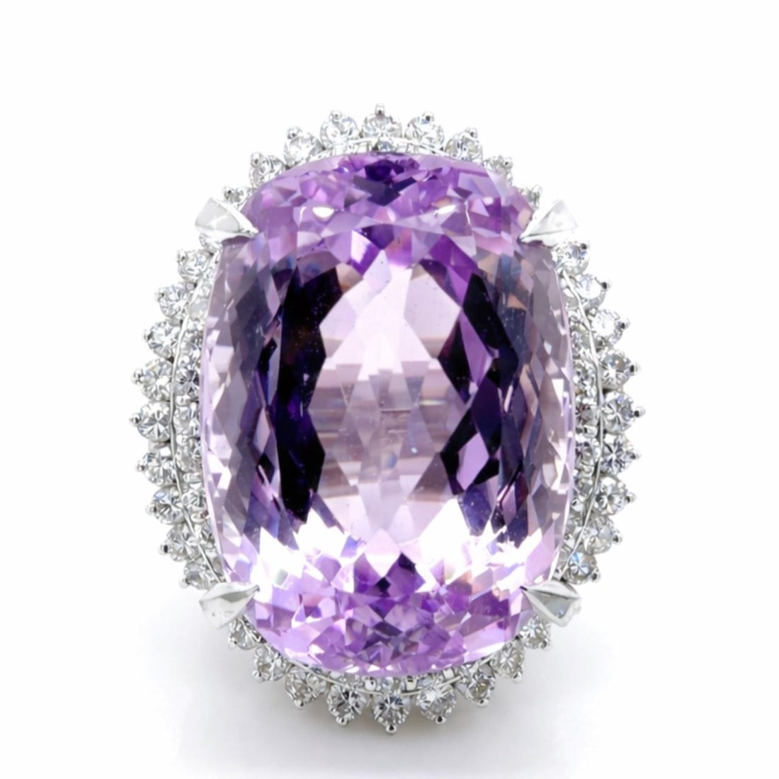 31.99 Carat Kunzite and Diamond Platinum Ring Size 5: 31.99 Carat Kunzite and Diamond Platinum Ring Size 5 This platinum ring features a striking 31.99 carat kunzite at its center, complemented by 1.76 carats of diamonds with G-H color and VS1-SI1 clarit