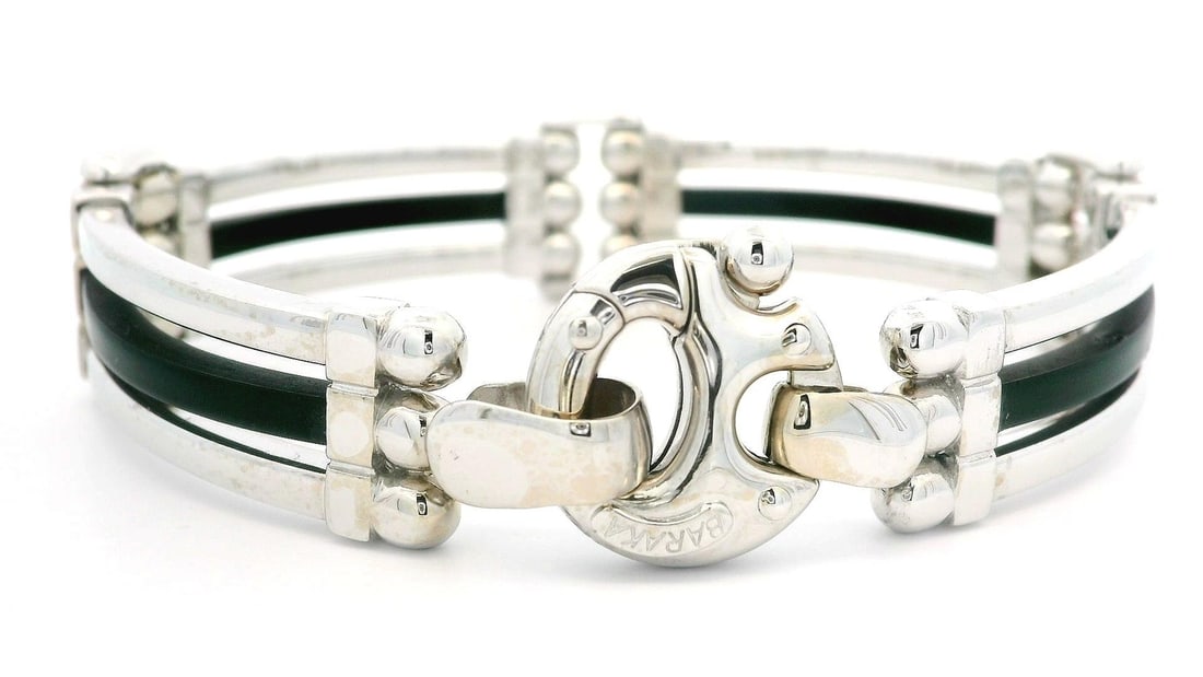 Baraka 18k White Gold Bracelet with Black Rubber Accents: Baraka 18k White Gold Bracelet with Black Rubber Accents This men's bracelet features a bold design crafted from solid 18k white gold with striking black rubber accents. The wide sectional link constr