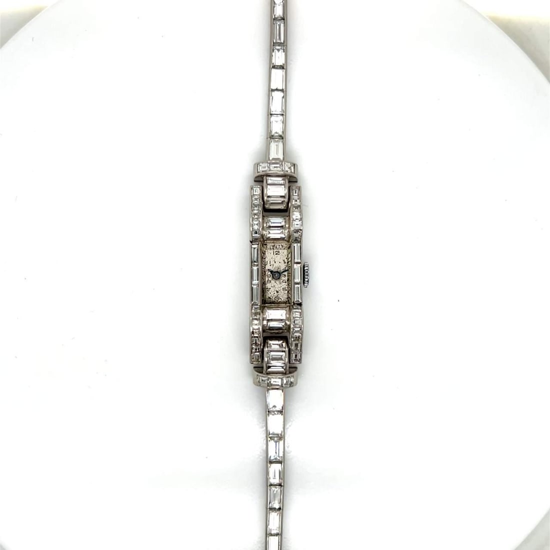 Art Deco Platinum Cocktail Watch with 76 Baguette Diamonds: Art Deco Platinum Cocktail Watch with 76 Baguette Diamonds Discover the elegance of this Art Deco Platinum Diamond Ladies Cocktail Watch. This exquisite timepiece features a stunning array of 76 bague