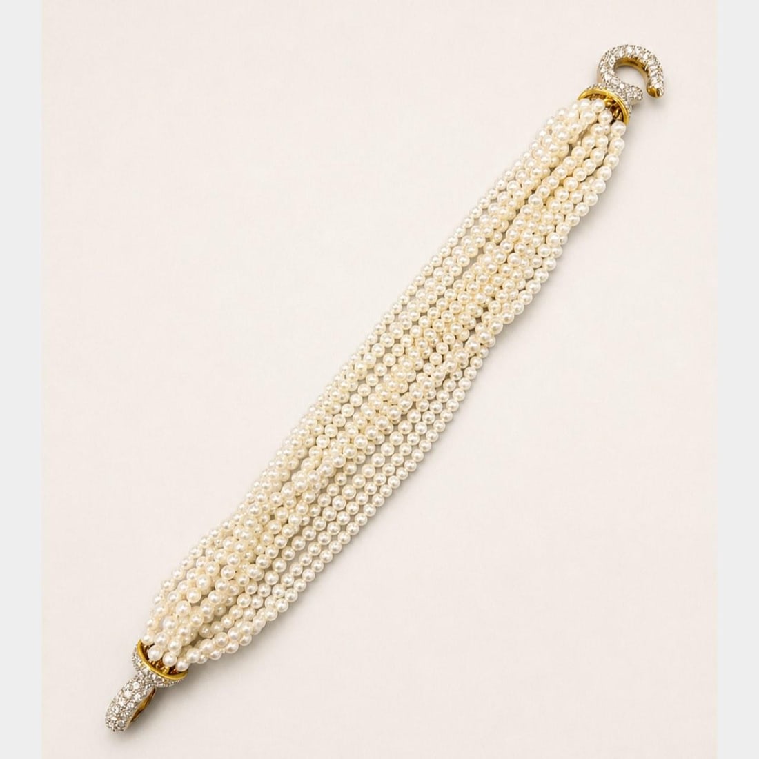 Pearl Diamond Bracelet in 18K Yellow Gold 7.75 Inch: Pearl Diamond Bracelet in 18K Yellow Gold 7.75 Inch This elegant bracelet is crafted from 18K yellow gold and features cultured pearls measuring between 3.05 and 3.10 mm. The bracelet is adorned with 