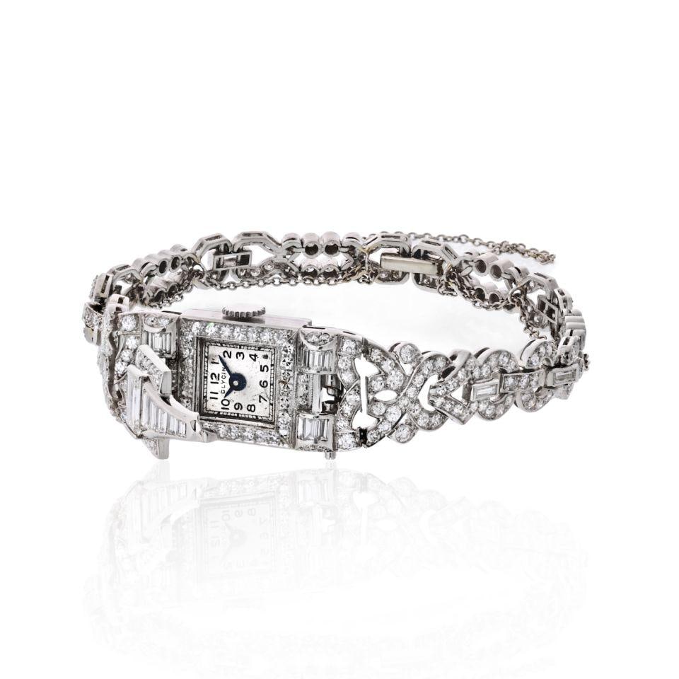 Art Deco Glycine Platinum Watch with 6.50ct Diamonds: Art Deco Glycine Platinum Watch with 6.50ct Diamonds Discover the elegance of this Art Deco Platinum wrist watch by Glycine, featuring approximately 6.50 carats of stunning round and baguette cut diam