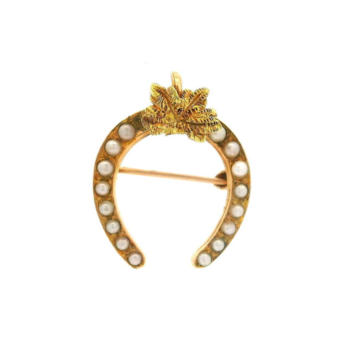 10k Yellow Gold Lucky Horseshoe Brooch with 16 Seed Pearls: 10k Yellow Gold Lucky Horseshoe Brooch with 16 Seed Pearls This antique brooch features a textured leaf and lucky horseshoe design crafted in 10k yellow gold. The pin is adorned with sixteen genuine c