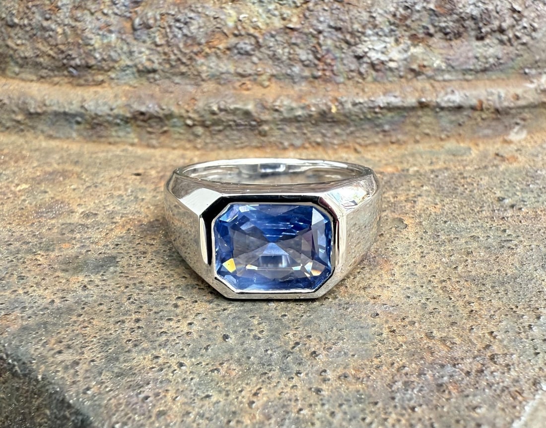 Platinum East West Ring With 3.12ct GIA No Heat Ceylon Sapphire: Platinum East West Ring With 3.12ct GIA No Heat Ceylon Sapphire This cocktail ring features a natural, no-heat Ceylon sapphire with a GIA certification, weighing 3.12 carats. The sapphire is octagonal