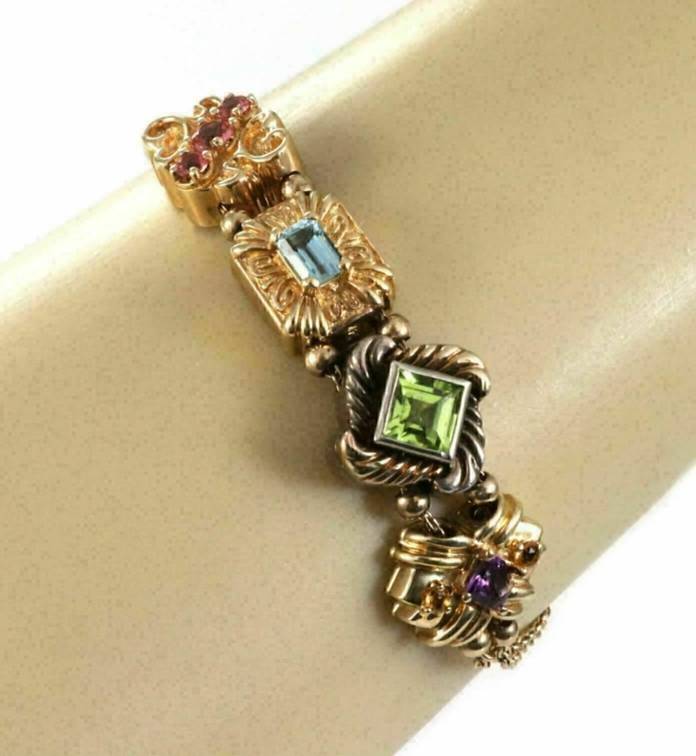 Vintage 14k Gold Sterling Charm Bracelet with 4 Gemstone Charms: Vintage 14k Gold Sterling Charm Bracelet with 4 Gemstone Charms This vintage multi-gemstone charm bracelet features a double-chain design crafted from 14k yellow gold and sterling silver. It is adorne