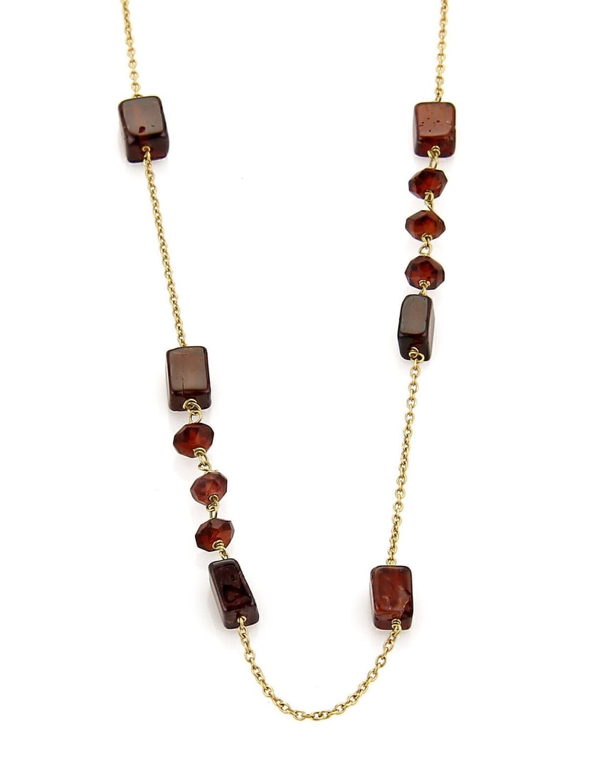 Vintage 18k Yellow Gold Garnet Beaded Necklace 28: Vintage 18k Yellow Gold Garnet Beaded Necklace 28 This vintage long chain necklace features a beaded design crafted from 18k yellow gold and adorned with richly colored garnet gemstones. The necklace 