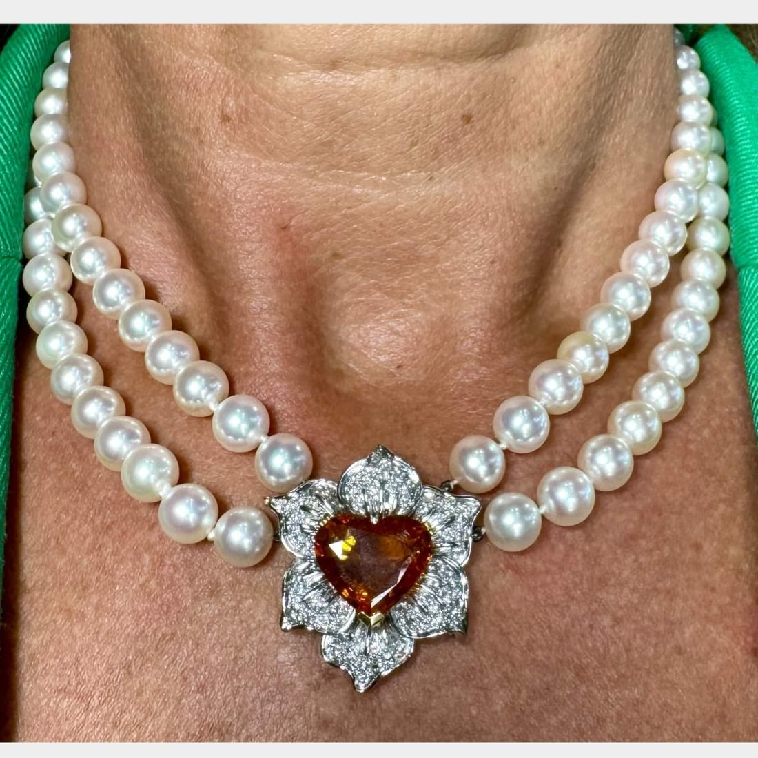 GIA Certified 7.95 Ct Orange Sapphire Diamond Pearl Necklace in 18K White Gold: GIA Certified 7.95 Ct Orange Sapphire Diamond Pearl Necklace in 18K White Gold This exquisite necklace features a stunning 7.95 Ct. heart-shaped orange sapphire, certified by GIA (GIA Certificate # 22