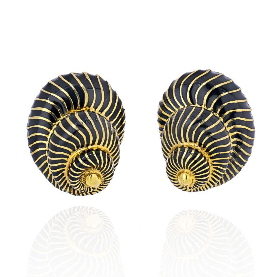 David Webb Platinum 18K Gold Black Enamel Seashell Clip-On Earrings: David Webb Platinum 18K Gold Black Enamel Seashell Clip-On Earrings Capture the essence of the ocean with these elegant David Webb earrings. Crafted in a stunning combination of platinum and 18K yello