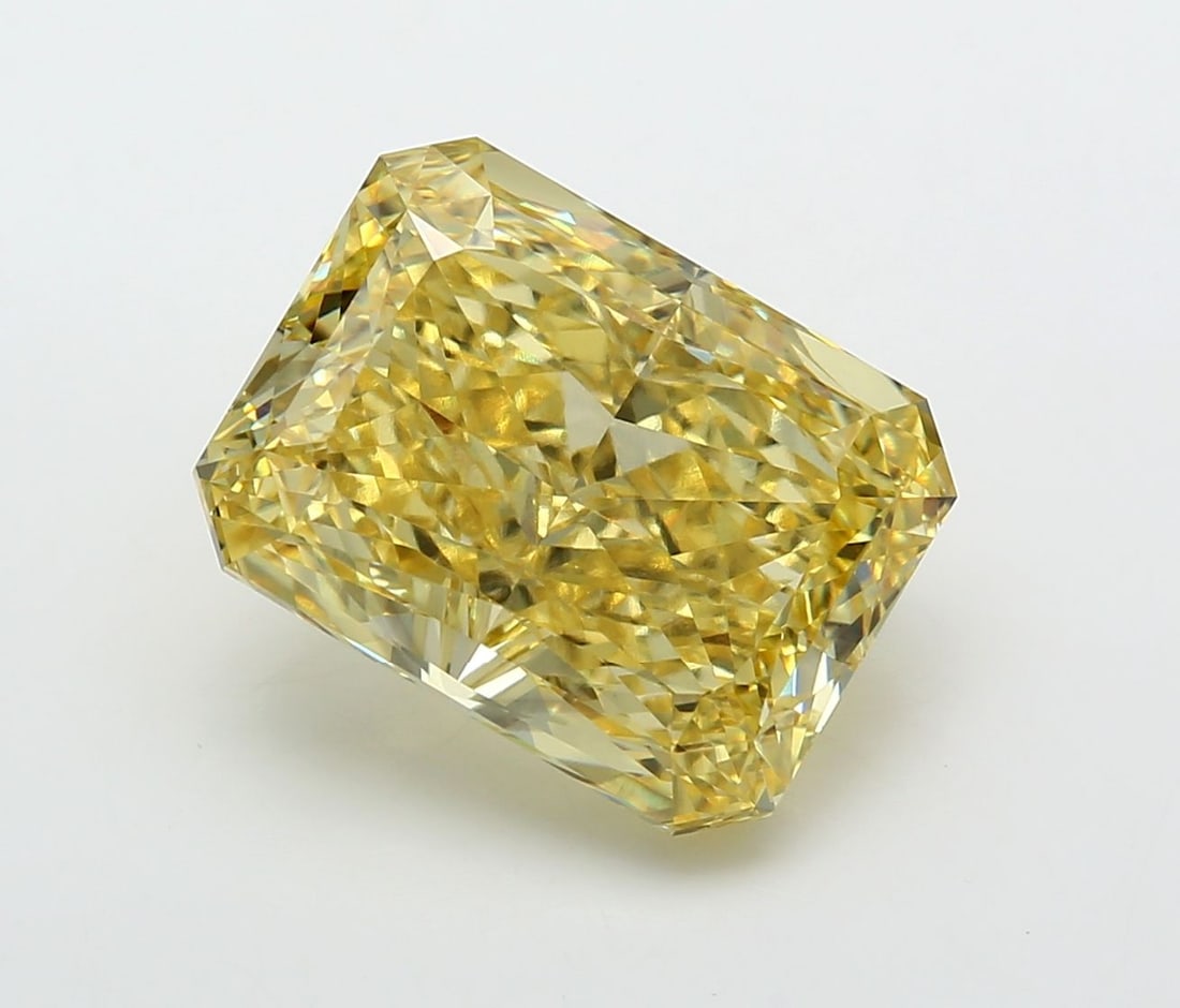 Loose Diamond - RADIANT 10.39ct Fancy Vivid Yellow VVS2: Loose Diamond - RADIANT 10.39ct Fancy Vivid Yellow VVS2 Source: This is a real non-mined Diamond that has been grown in a lab Shape: RADIANT Carats: 10.39 Color: Fancy Vivid Yellow Certification: IGI 