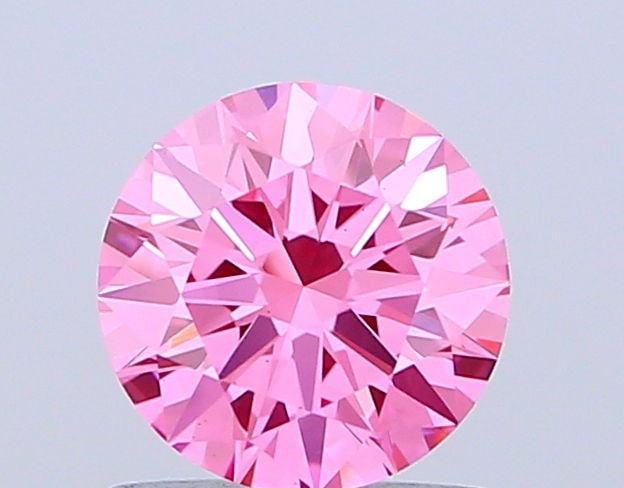 Ideal Loose Diamond - ROUND 1.07ct Fancy Vivid Pink VS2: Ideal Loose Diamond - ROUND 1.07ct Fancy Vivid Pink VS2 Source: This is a real non-mined Diamond that has been grown in a lab Shape: ROUND Carats: 1.07 Color: Fancy Vivid Pink Certification: IGI Video