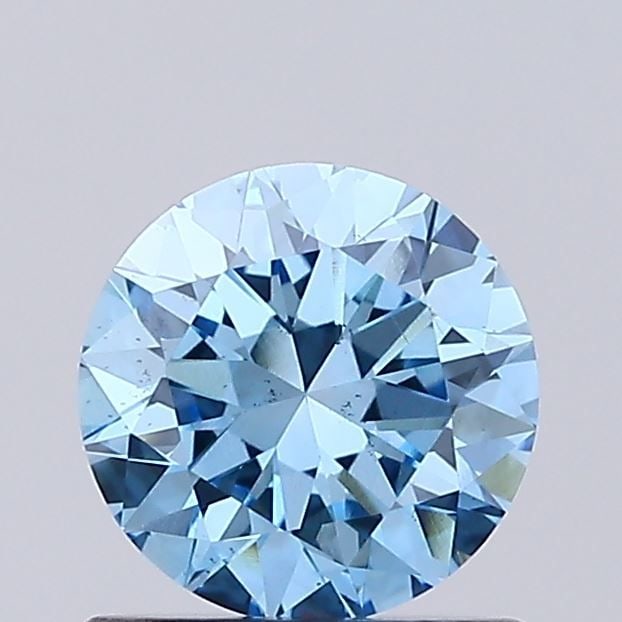Loose Diamond - ROUND 0.74ct Fancy Vivid Blue VS2: Loose Diamond - ROUND 0.74ct Fancy Vivid Blue VS2 Source: This is a real non-mined Diamond that has been grown in a lab Shape: ROUND Carats: 0.74 Color: Fancy Vivid Blue Certification: IGI Video: