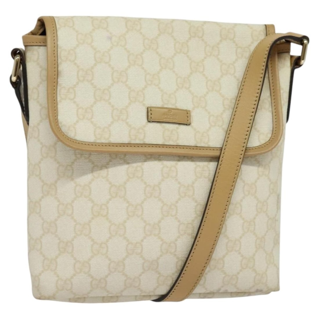 White GG Canvas Flap Messenger Bag by Gucci Unisex Italy: White GG Canvas Flap Messenger Bag by Gucci Unisex Italy This Gucci Flap Messenger bag is crafted from GG coated canvas in a white color, designed for unisex use. The bag features a flap closure and i
