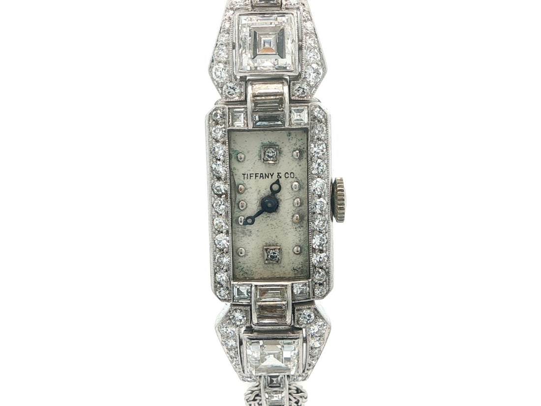 Art Deco Platinum Diamond Bracelet Watch by CH Meylan for Tiffany & Co.: Art Deco Platinum Diamond Bracelet Watch by CH Meylan for Tiffany & Co. This antique Art Deco wristwatch by Tiffany & Co. and CH Meylan features a rectangular platinum case and platinum bracelet. The 