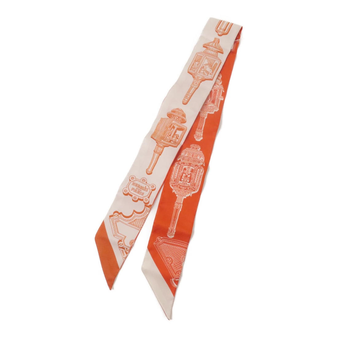 Hermes Twilly silk red women's scarf: Hermes Twilly silk red women's scarf This Hermes Twilly scarf is crafted from luxurious silk and features a vibrant red color. Designed for women, it offers a sophisticated accessory option that can b