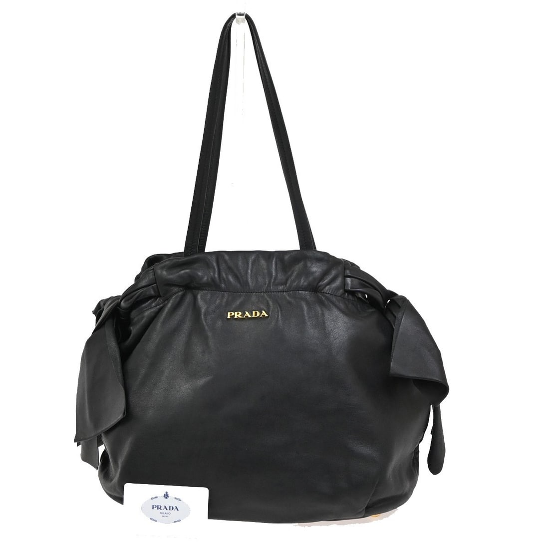 Prada Bow Tie Pleated Black Leather Tote Bag 34cm: Prada Bow Tie Pleated Black Leather Tote Bag 34cm This Prada Bow Tie Pleated Tote is crafted from black leather and features a pleated design. Designed for women, it offers both style and functionalit