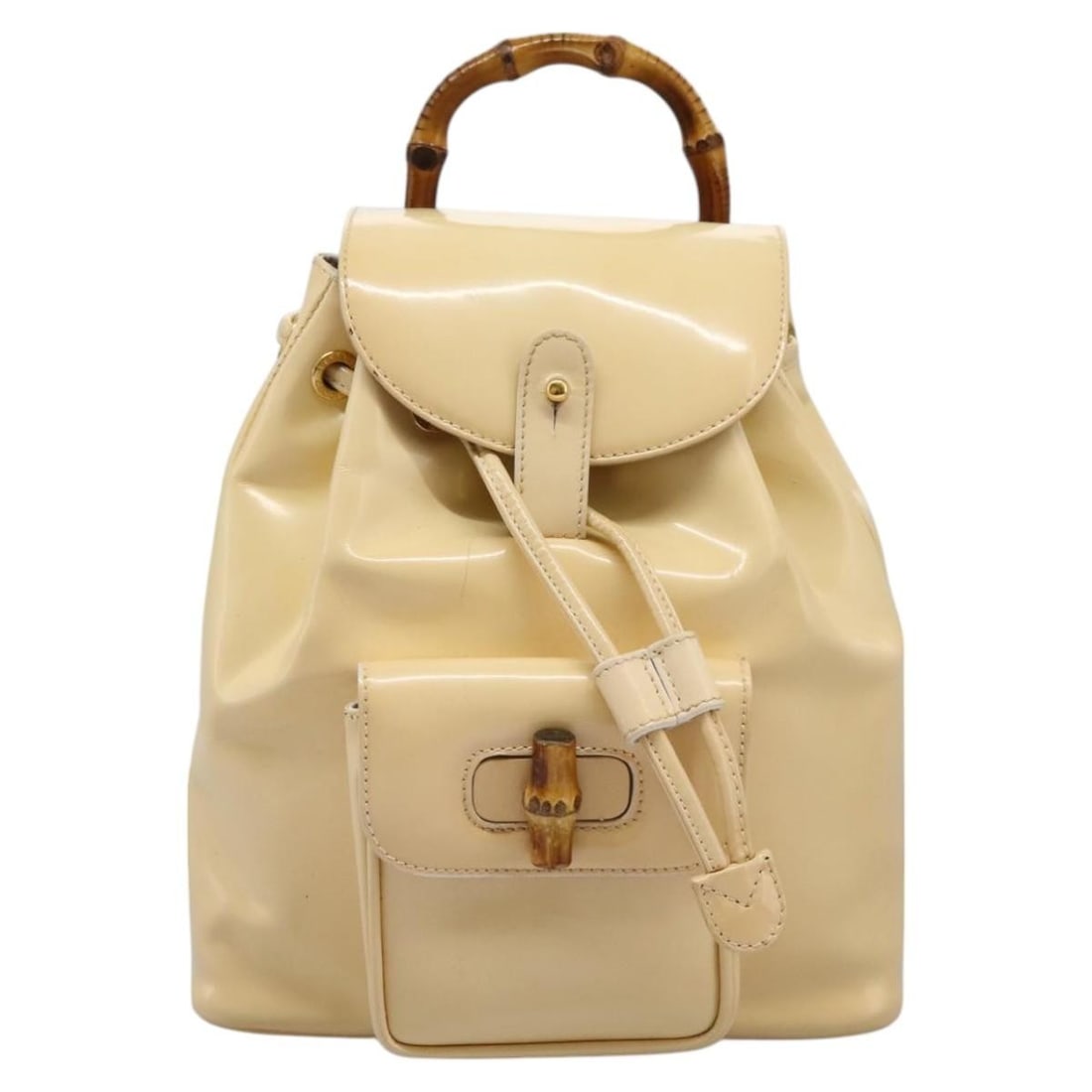 Beige Patent Leather Vintage Bamboo Backpack by Gucci for Women: Beige Patent Leather Vintage Bamboo Backpack by Gucci for Women This Gucci Vintage Bamboo Backpack features a beige patent leather exterior and signature bamboo detailing. Designed for women, the bag 
