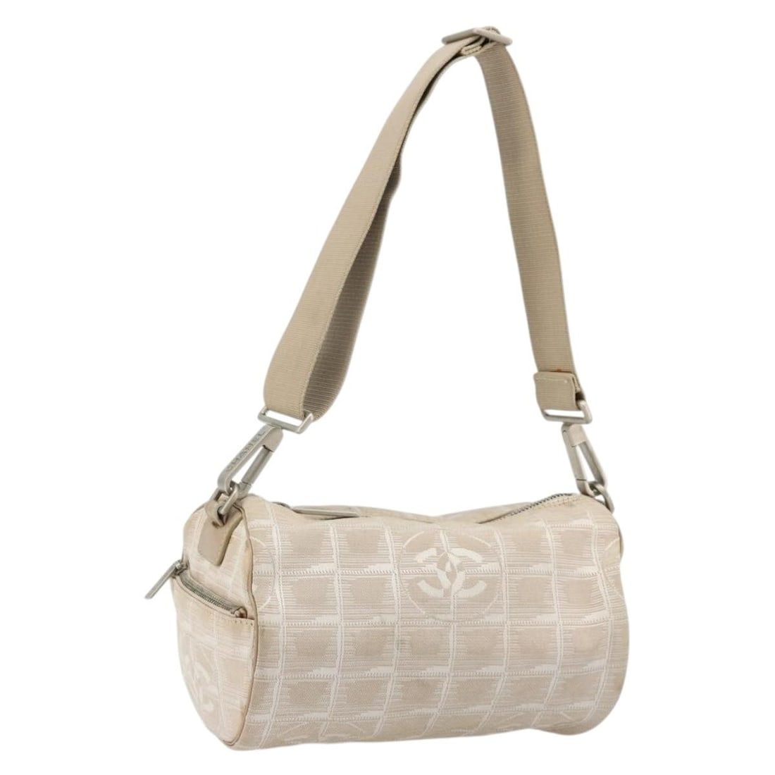 CHANEL Beige Silver Nylon Shoulder Bag New Travel Line Auth: CHANEL Beige Silver Nylon Shoulder Bag New Travel Line Auth This CHANEL Travel Line shoulder bag is crafted from beige and silver nylon, offering a lightweight and functional design. The bag features 
