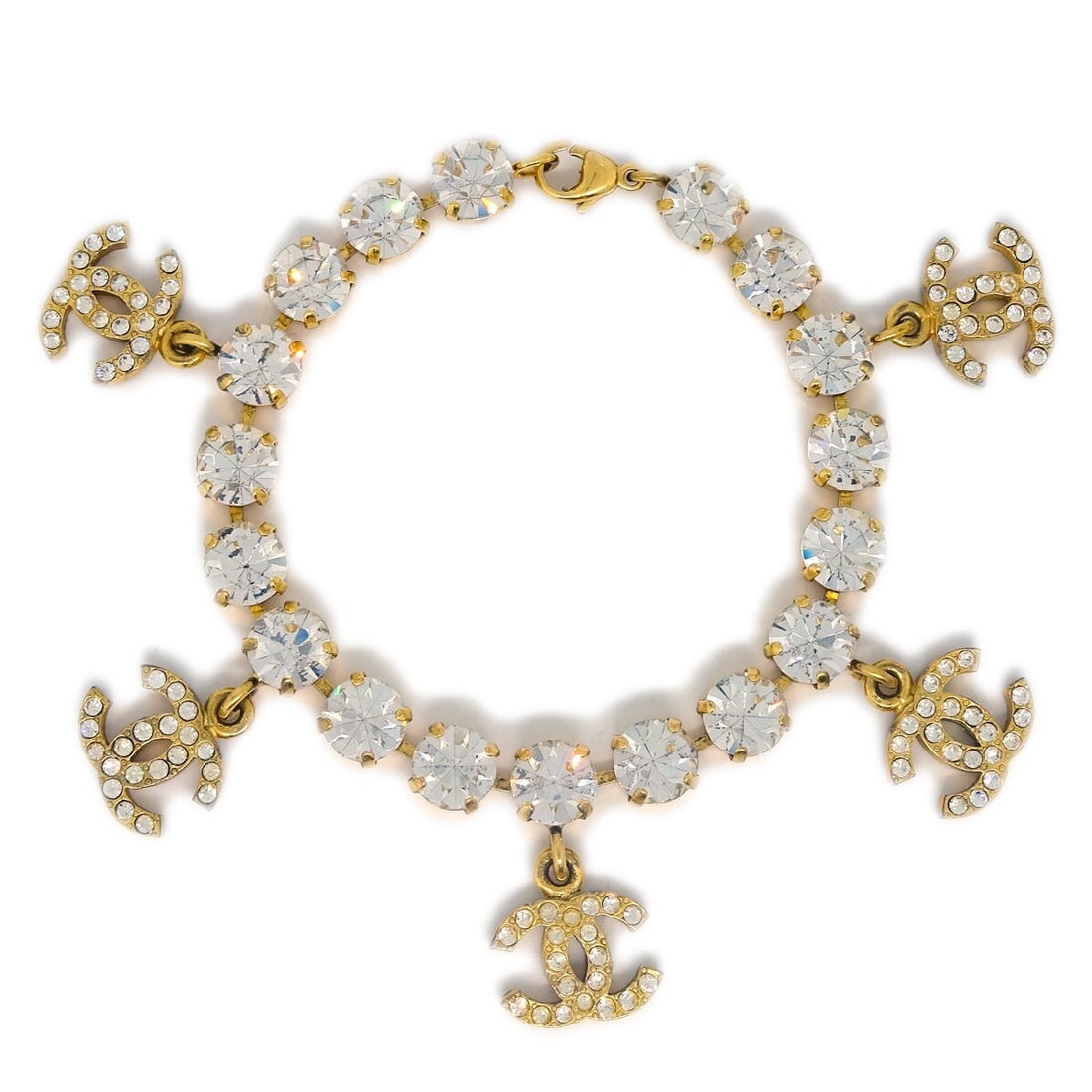 Chanel Rhinestone Chain Bracelet Gold Plated 96P: Chanel Rhinestone Chain Bracelet Gold Plated 96P This exquisite Chanel Rhinestone Chain Bracelet is a stunning accessory that brings elegance to any outfit. Crafted with a luxurious gold-plated finish