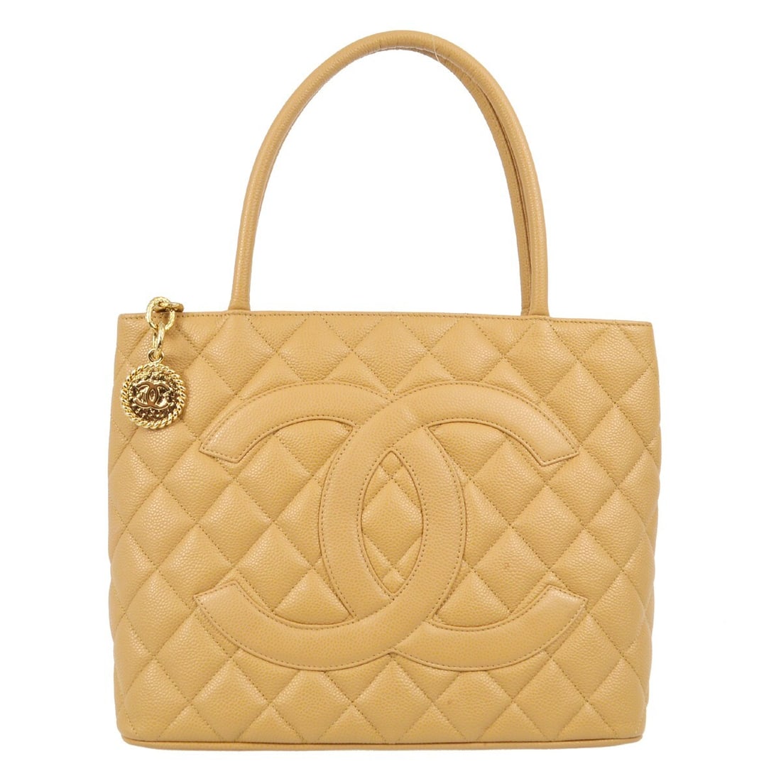 CHANEL Beige Caviar Leather Matelasse Tote Bag: CHANEL Beige Caviar Leather Matelasse Tote Bag This Chanel Beige Calfskin Medallion Tote Handbag features a luxurious caviar skin leather exterior with the signature matelasse quilted pattern and a pr