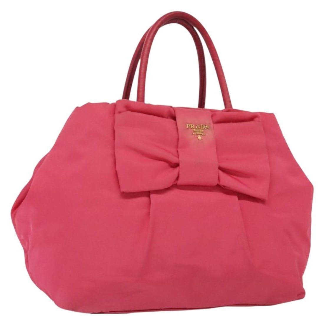 Prada pink nylon handbag Italy 10.6 x 9.4 x 5.9 inch: Prada pink nylon handbag Italy 10.6 x 9.4 x 5.9 inch This PRADA handbag is crafted from pink and gold nylon and features a structured silhouette with dual handles. Designed for women, it is made in It