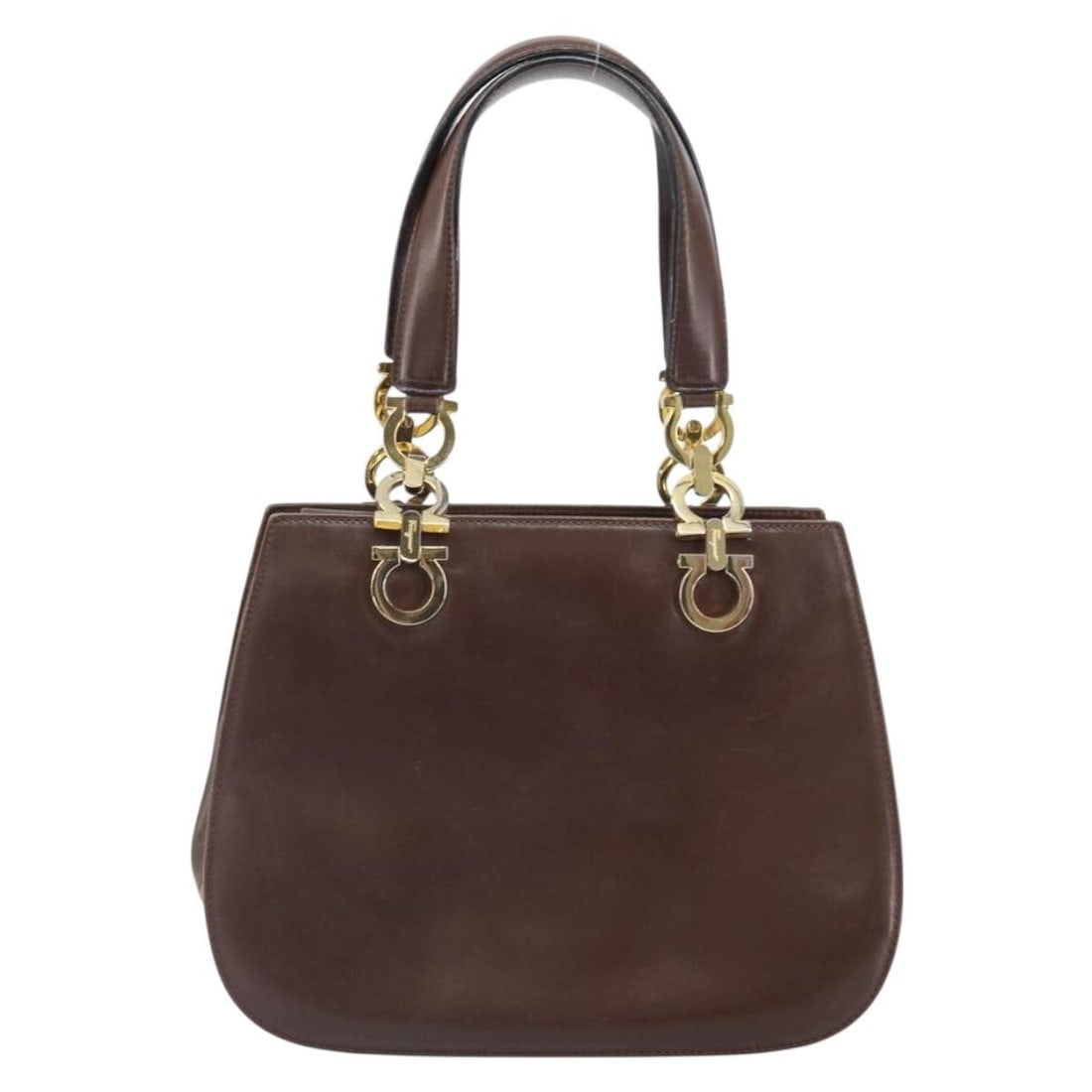 Salvatore Ferragamo Gancini Brown Leather Purse 25cm by 20cm by 9cm: Salvatore Ferragamo Gancini Brown Leather Purse 25cm by 20cm by 9cm This Salvatore Ferragamo Gancini handbag is crafted from brown leather and designed for female use. It features a compact structure 