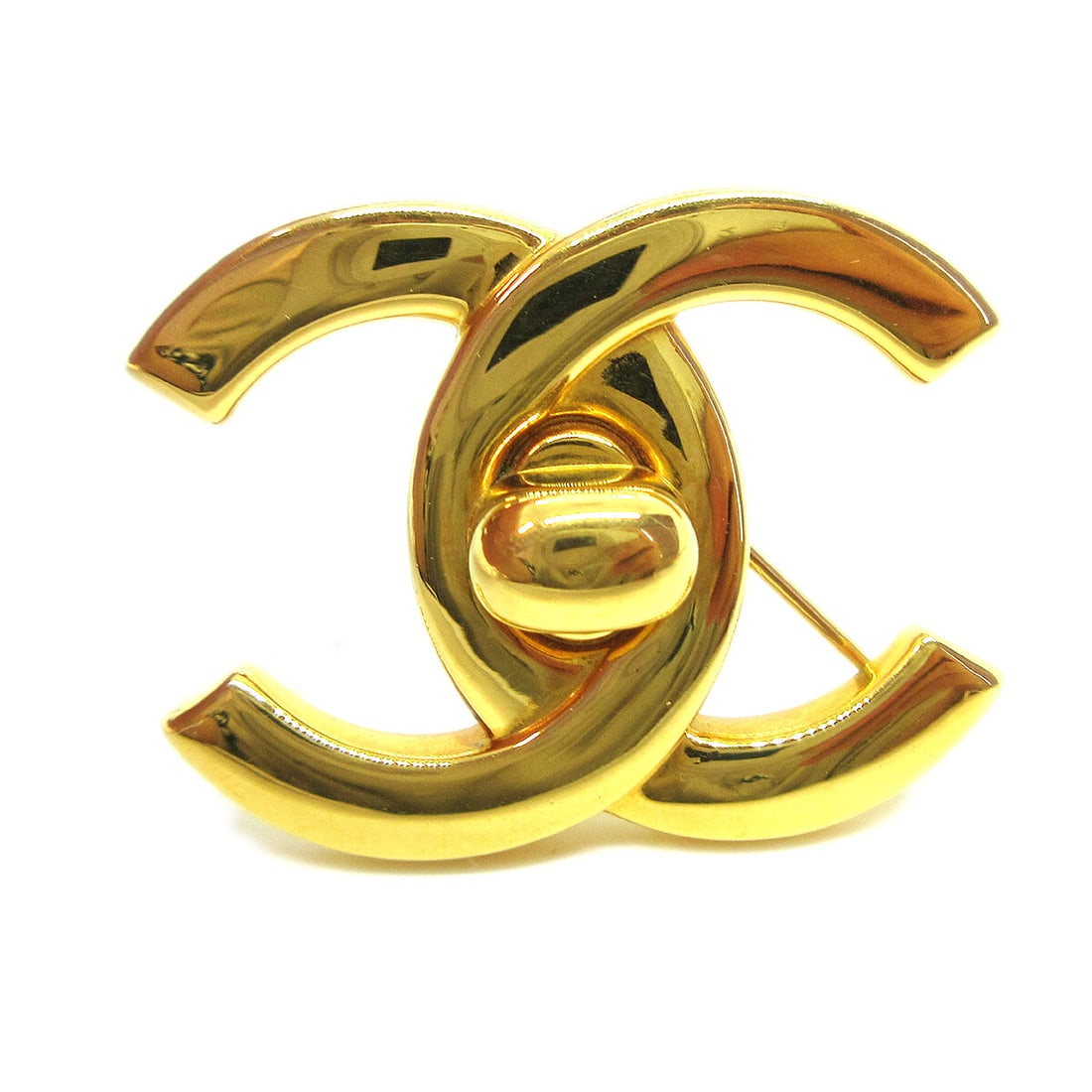 Chanel 96A Gold Turnlock Brooch Pin Fashion Accessory: Chanel 96A Gold Turnlock Brooch Pin Fashion Accessory This stunning Chanel Turnlock Brooch Pin in a beautiful gold finish is a must-have accessory for any fashion enthusiast. Crafted from gold-plated 