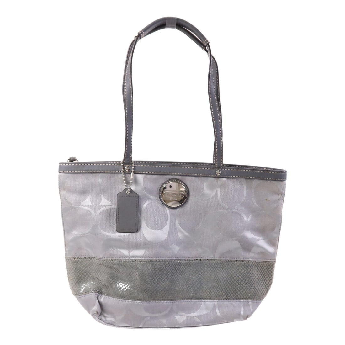 Coach Canvas Tote Gray Silver Hardware United States: Coach Canvas Tote Gray Silver Hardware United States This COACH tote bag features a durable gray canvas exterior and offers ample space for everyday essentials. Designed in a regular size, the bag is 