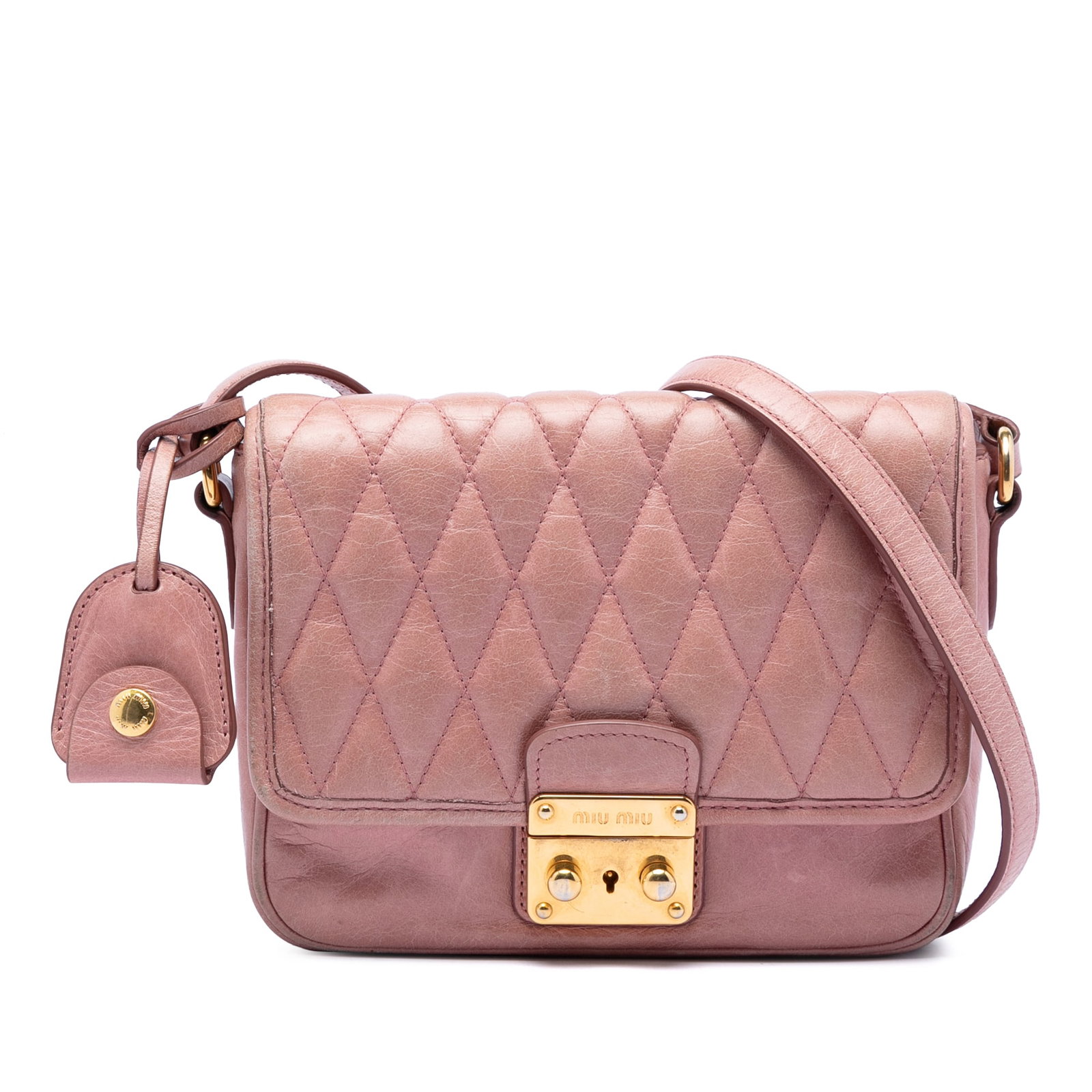 Miu Miu Pink Quilted Leather Vitello Shine Crossbody Bag: Miu Miu Pink Quilted Leather Vitello Shine Crossbody Bag This Miu Miu Vitello Shine Trapu Crossbody features a quilted leather body in pink, an adjustable flat leather strap, and a front flap with a p