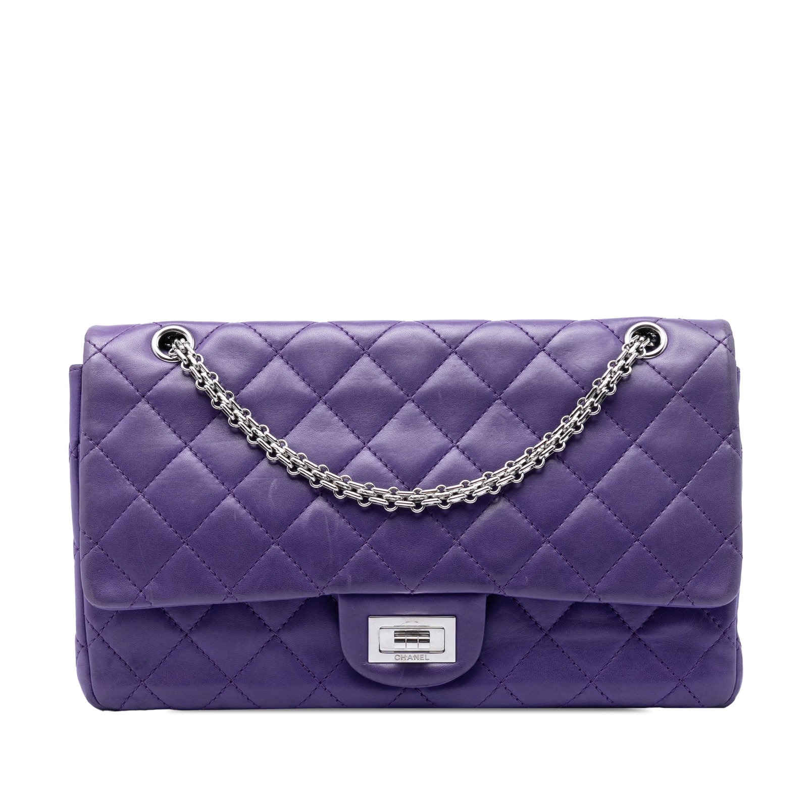 Chanel 2.55 Reissue purple lambskin flap shoulder bag: Chanel 2.55 Reissue purple lambskin flap shoulder bag This Chanel Quilted Lambskin Reissue 2.55 Double Flap 227 shoulder bag showcases a luxurious quilted lambskin leather exterior in purple, compleme