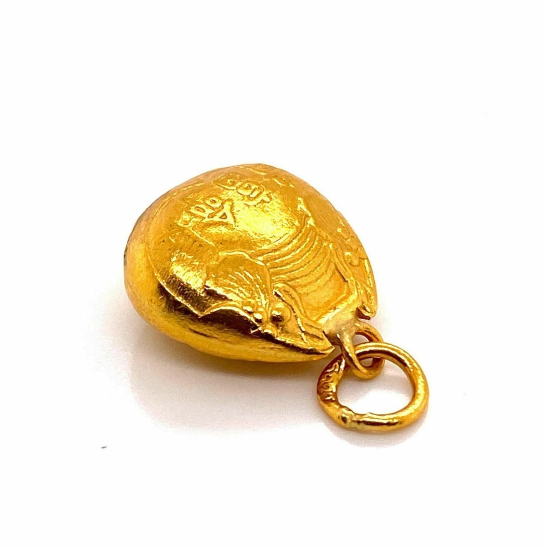 Vintage 24k Gold Oriental Bell Charm Pendant: Vintage 24k Gold Oriental Bell Charm Pendant This vintage Oriental bell charm pendant is crafted from 24k gold, featuring a sculptural bell motif. The pendant is unbranded and showcases a petite, dime