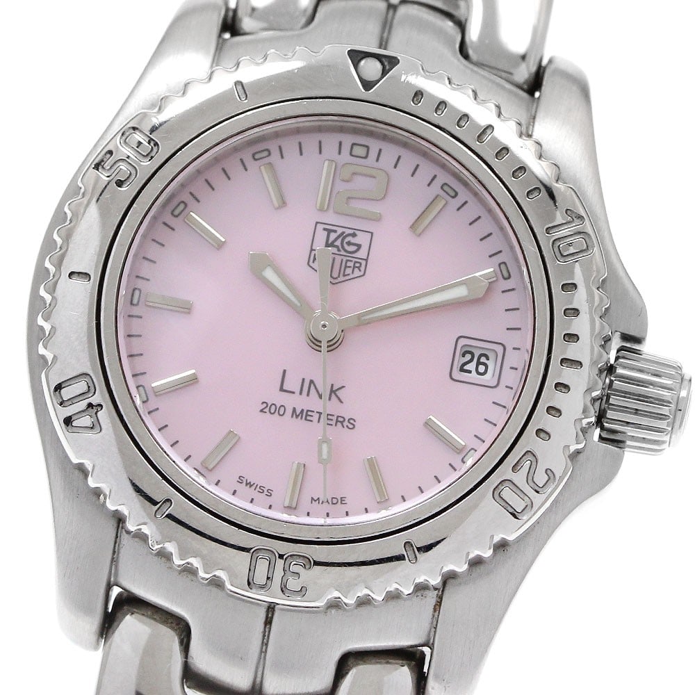 TAG Heuer Link WT141M Pink Shell Quartz Ladies Watch: TAG Heuer Link WT141M Pink Shell Quartz Ladies Watch This TAG HEUER Link Date Quartz women's wristwatch features a stainless steel case and bracelet with a pink shell dial. The watch is powered by a q