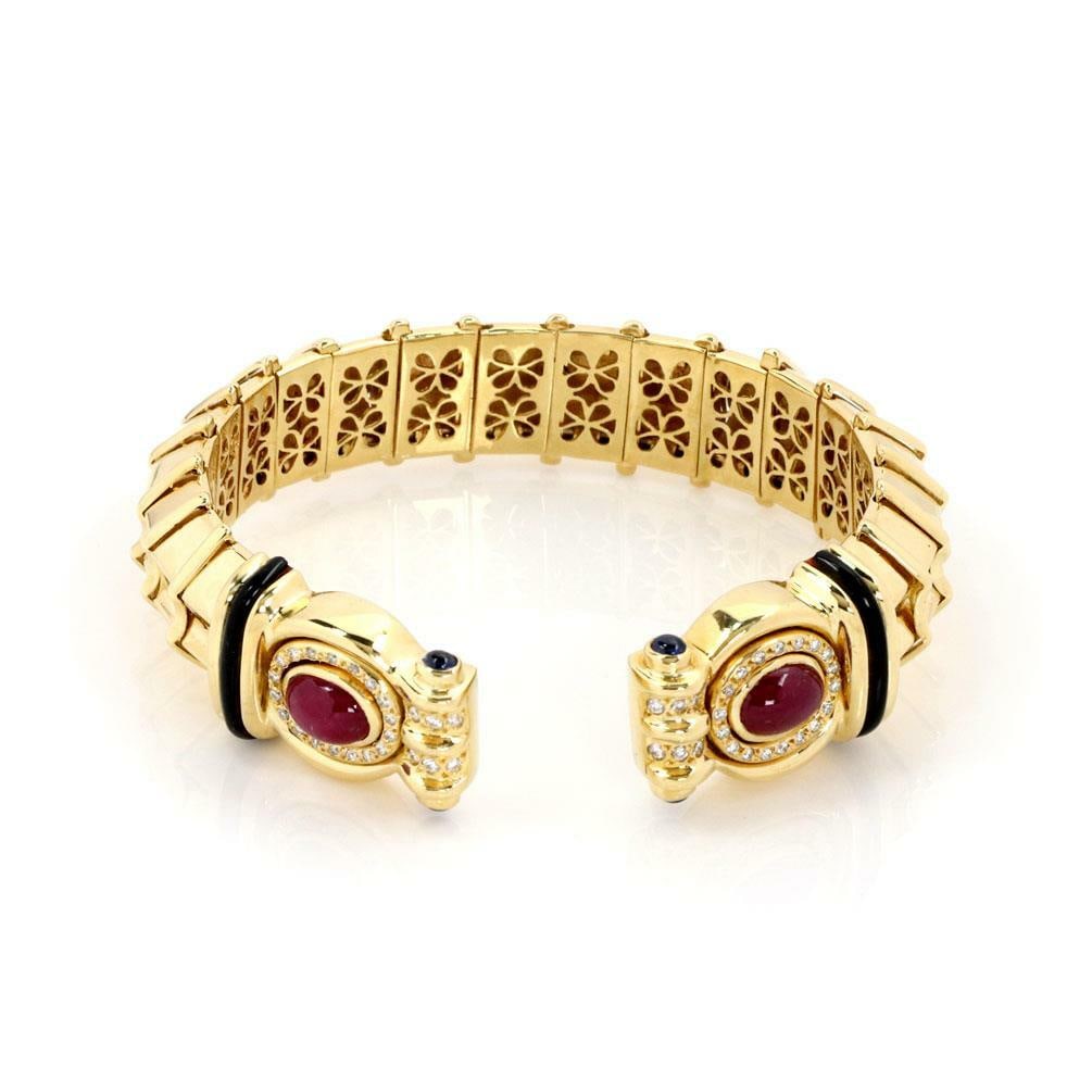 Denior 18k Gold Diamond Ruby Sapphire 15.5mm Flex Cuff Bracelet: Denior 18k Gold Diamond Ruby Sapphire 15.5mm Flex Cuff Bracelet This stunning cuff bracelet by Brazilian designer Denior showcases exquisite craftsmanship in 18k yellow gold with a polished finish. It