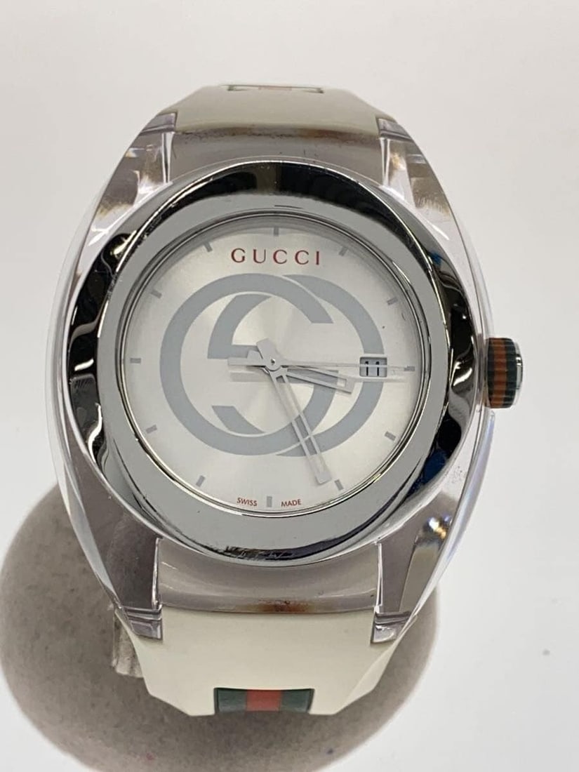 Gucci Synk White Rubber Quartz Men's Wristwatch: Gucci Synk White Rubber Quartz Men's Wristwatch This is a GUCCI SYNK Quartz 137.1 men's wristwatch featuring a white rubber band and case. The watch is Swiss-made and shows slight signs of use, consis