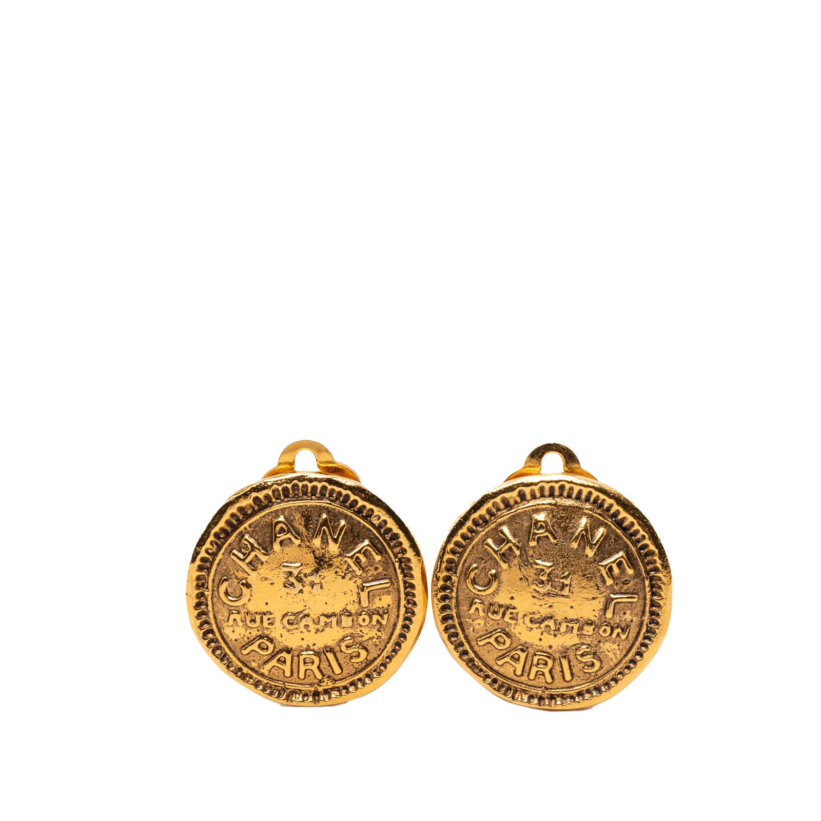 Chanel 31 Rue Cambon Gold Tone Round Clip Earrings: Chanel 31 Rue Cambon Gold Tone Round Clip Earrings These Chanel round clip-on earrings are crafted from gold tone metal and feature a classic design inspired by 31 Rue Cambon. They are designed with b