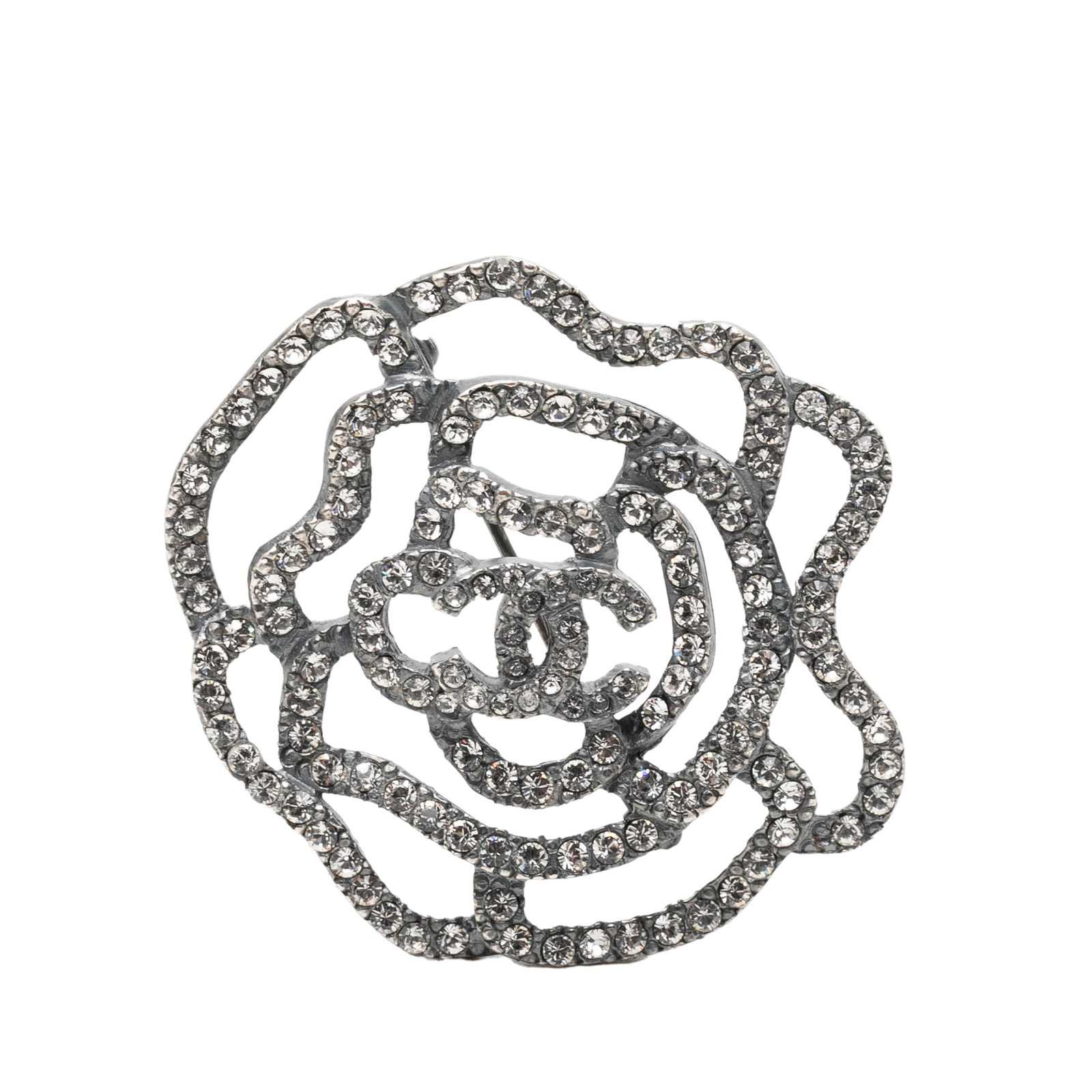 Chanel Camelia Strass Brass Pin Brooch: Chanel Camelia Strass Brass Pin Brooch This Chanel Camelia pin brooch showcases a brass metal body adorned with sparkling strass embellishments. The brooch is designed with a back pin closure and come