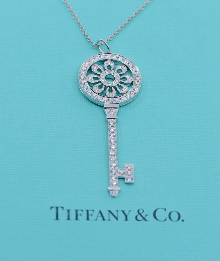 Diamond Key Pendant Necklace in 18k White Gold by Tiffany & Co: Diamond Key Pendant Necklace in 18k White Gold by Tiffany & Co This Tiffany & Co. necklace features a large key-shaped pendant crafted in 18k white gold and adorned with diamonds. Part of the Tiffany 