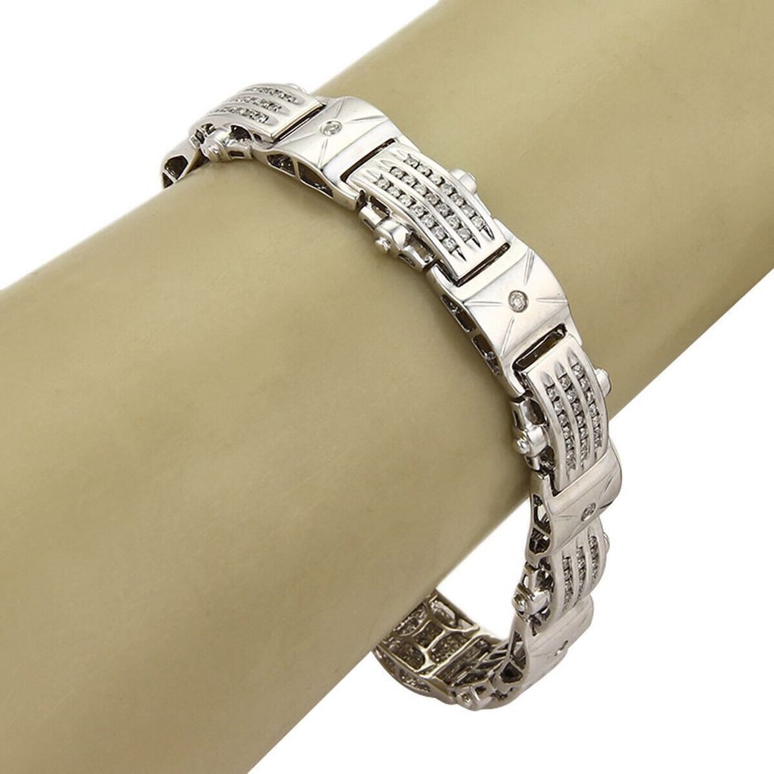 Vintage 14k White Gold Diamond Curved Link Bracelet: Vintage 14k White Gold Diamond Curved Link Bracelet This vintage bracelet features elegant curved links crafted in solid 14k white gold and is accented by channel-set diamonds. The polished white gold
