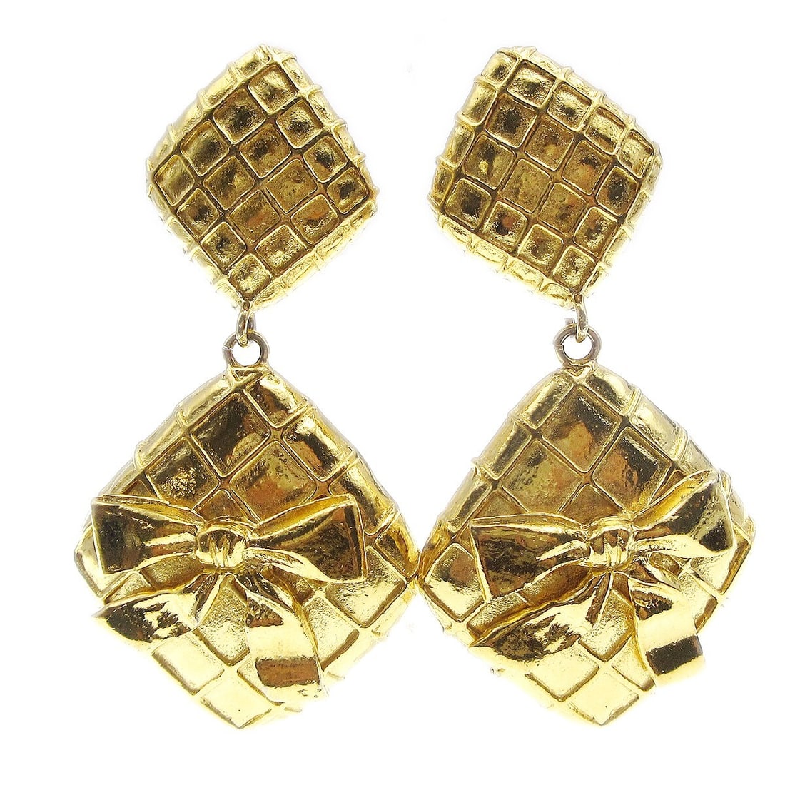 Chanel Gold Quilted Bow Clip-On Dangle Earrings: Chanel Gold Quilted Bow Clip-On Dangle Earrings Elevate your accessory collection with these elegant Chanel Quilted Bow Dangle Earrings. Designed with a luxurious gold finish, these clip-on earrings f