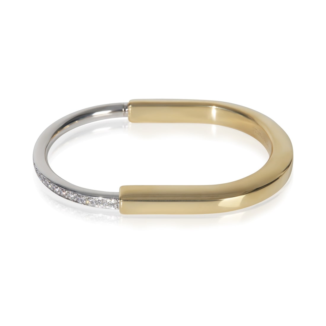 Tiffany & Co. Lock Diamond Bracelet 18k White Yellow Gold Small: Tiffany & Co. Lock Diamond Bracelet 18k White Yellow Gold Small This Tiffany & Co. Lock bracelet is crafted from 18k white and yellow gold and features a round brilliant diamond design with a total di