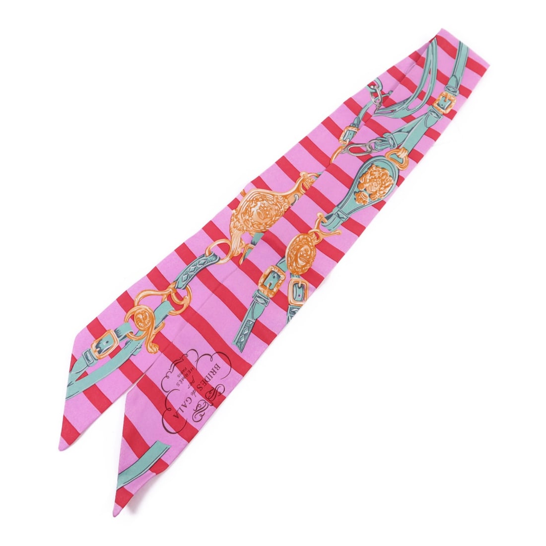 Silk Pink Multicolor Twilly Scarf by Hermes France: Silk Pink Multicolor Twilly Scarf by Hermes France This Hermes Twilly scarf is crafted from luxurious silk in a vibrant pink and multicolour design. Made in France, it features a regular size and offe