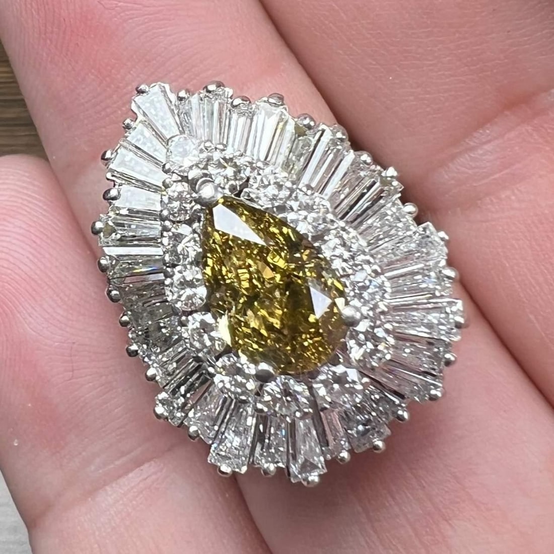 Vintage 1950's Platinum 2.02 Ct GIA Fancy Diamond Ring: Vintage 1950's Platinum 2.02 Ct GIA Fancy Diamond Ring This stunning 1950's Platinum ring features a remarkable 2.02 Ct. GIA Certified Pear-shape Diamond, exhibiting a natural Fancy Deep Brownish Gree