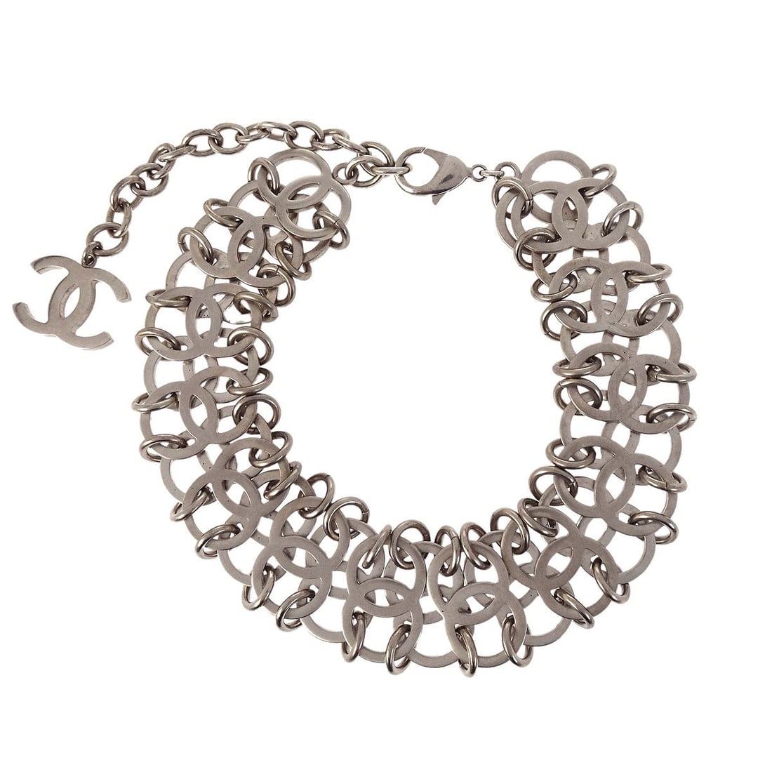 CHANEL silver plated CC choker necklace B16S: CHANEL silver plated CC choker necklace B16S This Chanel choker necklace features the iconic CC logo in a silver color. Crafted in Italy, it is made from silver-plated material and designed in a choke