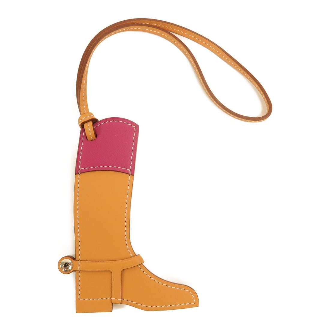 Hermes Paddock Boot Charm Brown Veau Swift Leather: Hermes Paddock Boot Charm Brown Veau Swift Leather This Hermes Paddock Boot Charm is crafted from high-quality Veau Swift calfskin leather in a brown and purple color combination. Designed as a stylis