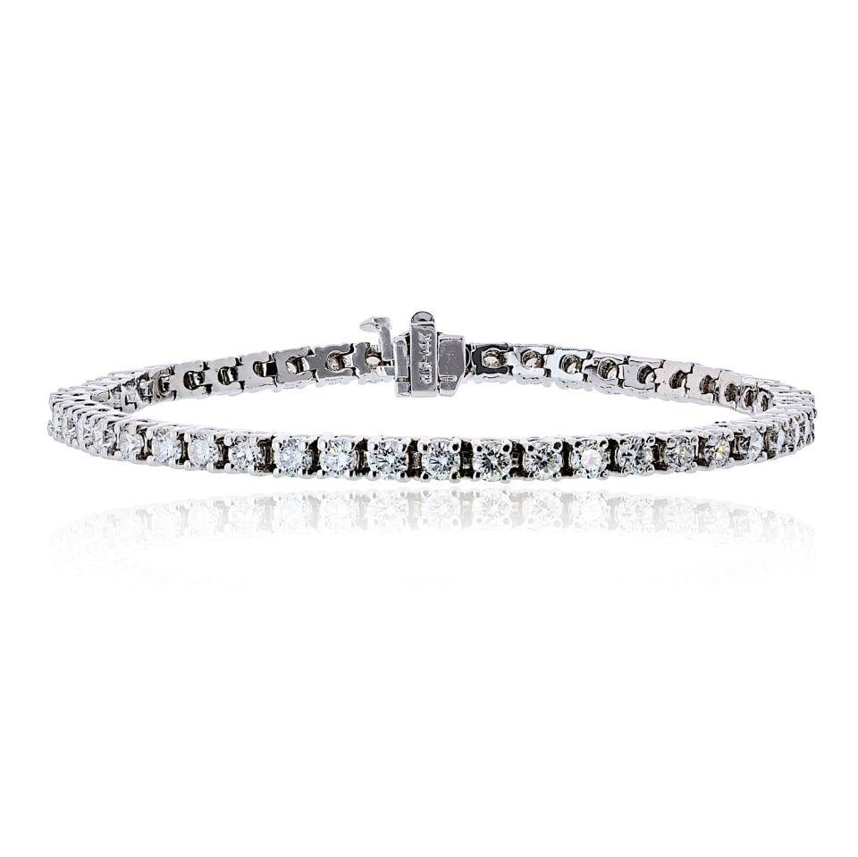 14K White Gold Diamond Tennis Bracelet 4.98 cttw 7 Inch Box Clasp: 14K White Gold Diamond Tennis Bracelet 4.98 cttw 7 Inch Box Clasp This tennis bracelet is crafted from 14K white gold and features natural round brilliant cut diamonds with a total weight of approxima